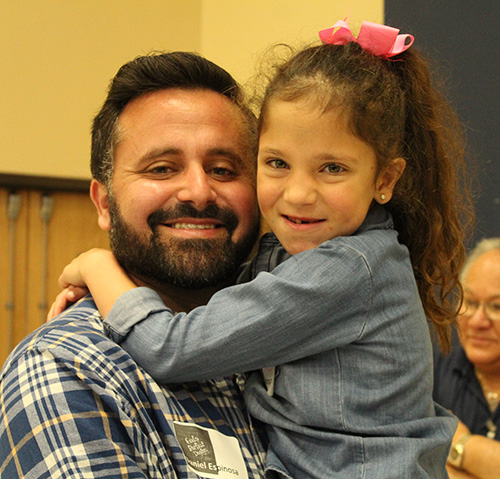 Daddy's girl: Demi Espinosa embraces her father, Daniel Espinosa, during the God's Perfect Design retreat.