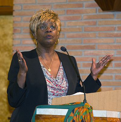 Katrenia Reeves Jackman, director of archdiocesan Office of  Black Catholic Ministry, talks to the congregation at the end of the first night of the annual black Catholic pre-Lent revival, held Feb. 12-15.