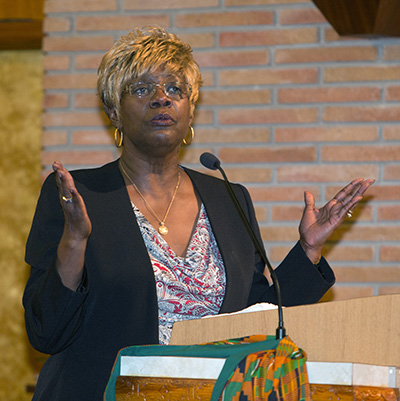 Katrenia Reeves Jackman, director of archdiocesan Office of Black Catholic Ministry, talks to the congregation at the end of the first night of the annual black Catholic pre-Lent revival, held Feb. 12-15.