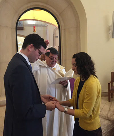 Father Miguel Gonzalez blesses Catholic millennials Matthew Mangiaracina and his fiancee, Lia Del Guercio, during their betrothal ceremony, held at St. James Cathedral in Orlando Dec. 17, 2016.