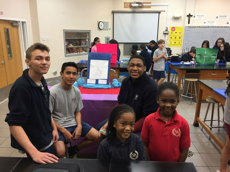 St. Andrew School eighth-graders present their engineering project to the school's third graders during the school's first Celebrate Engineering Fair.