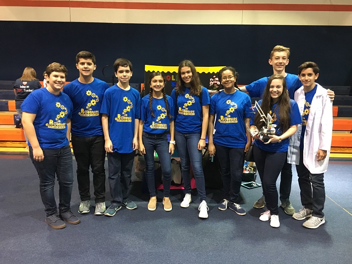 Our Lady of the Lakes' 8th Grade Robotics Team hold up the fourth place trophy they won at the Florida First Robotics Competititon. Front row, from left: Vicente Tome, Michael Gonzalez, Luis Victores, Alexa Gonzalez, Sofia Kunkel, Agatha Zapata, Isabella Cardoso, Michael Sanchez; back row: Sebastiaan Bak.