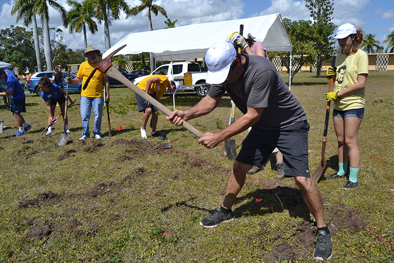 Tony Buzone uses a pick during the labyrinth groundbreaking at MorningStar Renewal Center.