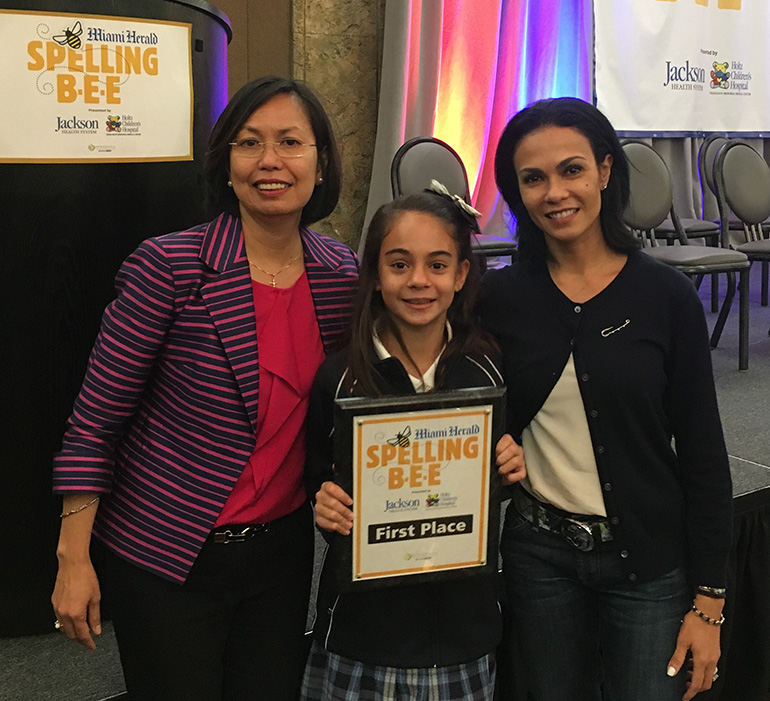 St. Bonaventure fifth grader Simone Kaplan poses with her first place certificate after the Broward County spelling bee. With her are the school's resource teacher, Stella DiBattista, left, and Simone's mother, Alana Kaplan.
