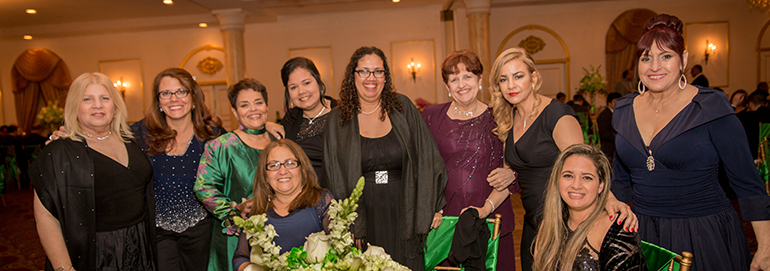 A group of St. Michael School teachers pose with Principal Carmen Alfonso, third from left, standing.