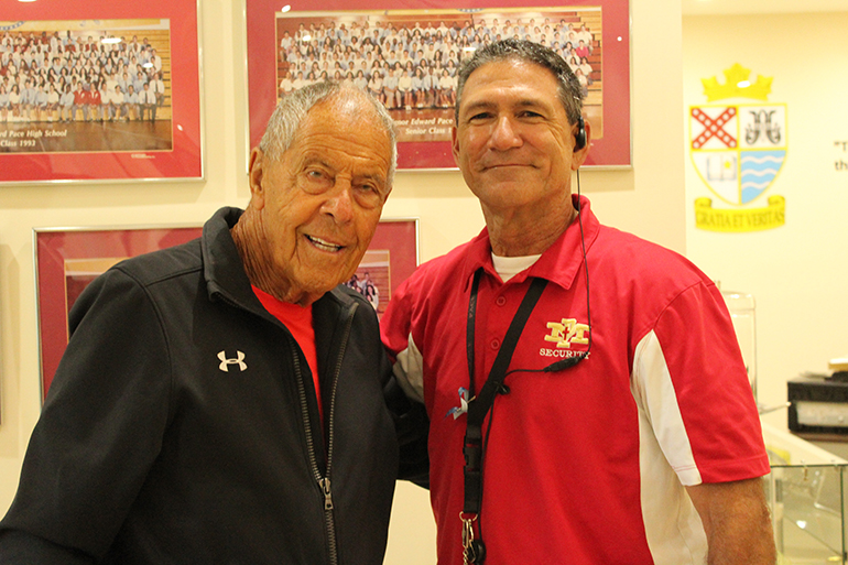 Tennis twosome: Pro tennis coaching legend Nick Bollettieri poses with Msgr. Edward Pace High School tennis coach Anthony Lilly during Bollettieri's visit to Pace March 28.