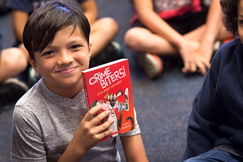 “Crime Biters!”, an illustrated children’s book by Tommy Greenwald, was on display for third, fourth and fifth-grade students at St. Ambrose School in Deerfield Beach gathered in early April for a book fair and author lecture with Greenwald.