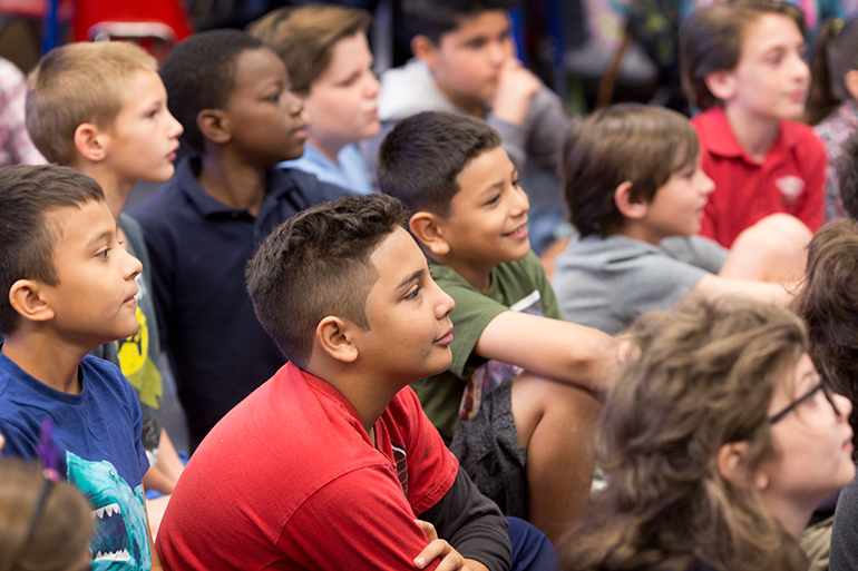 The third, fourth and fifth-grade students at St. Ambrose School in Deerfield Beach gathered in early April for a book fair and author lecture with Greenwald.