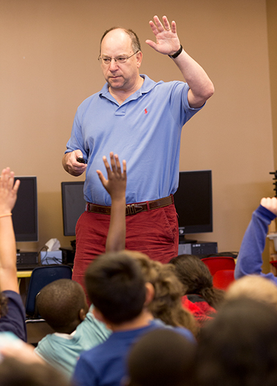 Children’s book author Tommy Greenwald speaks with  third, fourth and fifth-grade students at St. Ambrose School in Deerfield Beach gathered in early April for a book fair and author lecture.