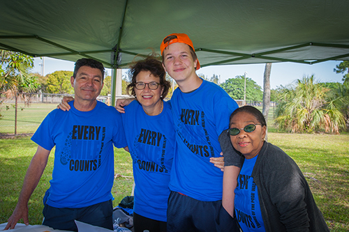 Evelio Suarez, far left, newly installed president of the St. Vincent de Paul Conference at Our Lady of Lourdes Parish in Kendall, poses with some members of his team during the "walk for the poor."