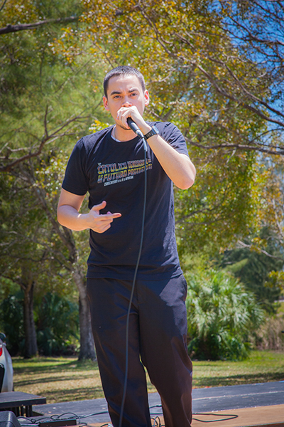 Catholic rapper and hip-hop artist Alvaro "Communion" Vega, entertains participants at the "walk for the poor" at Tropical Park.