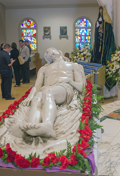 Images of a lifeless Jesus and Mary, the Mother of Sorrows, are displayed on the altar of St. Mary Cathedral after the Good Friday Service of the Lord's Passion. Both would be taken through the streets in procession after the evening Passion Service.
