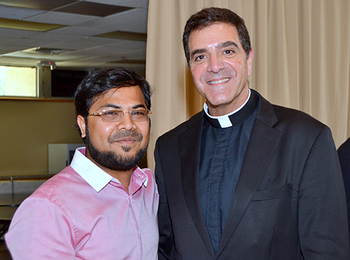 Msgr. Michael Souckar of St. Andrew poses for a photo with Imam Hafiz Furkhan Hakeem of the Islamic Foundation of South Florida.
