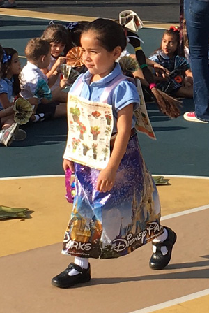 Sts. Peter and Paul student Cindy Lucia Perez walks down the runway at the recycle fashion show.
