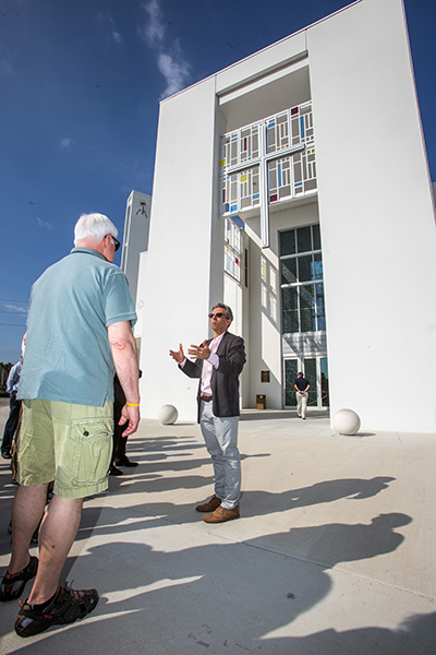 Jose Murguido, partner at Zyscovich Architects, tells members of the Conference for Catholic Facility Management about Our Lady of Guadalupe Church in Doral during a site visit on the last day of their national meeting, which was hosted by the Archdiocese of Miami. The group also visited the Innovation Center at St. Brendan High School in Miami.