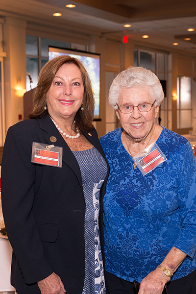 Keynote speaker Judge Melanie May, left, poses with Adrian Dominican Sister John Norton, retired from St. Thomas Aquinas High School in Fort Lauderdale, where May taught before entering the legal profession. Judge May was the keynote speaker at the banquet that followed the 28th annual Red Mass of the St. Thomas More Society of South Florida.