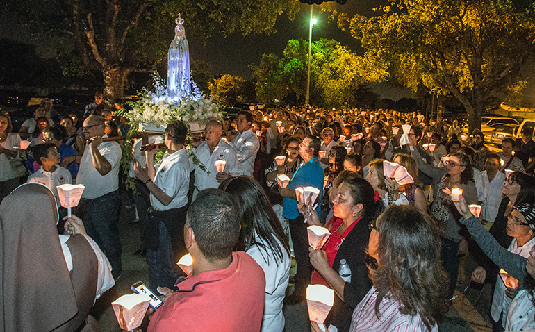 A statue of Our Lady of Fatima is carried around St. Michael Church during the candlelight procession May 13.