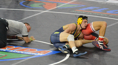 St. Thomas Aquinas student wrestler Grant Aronoff in action. He successfully defended his 138-pound individual title.