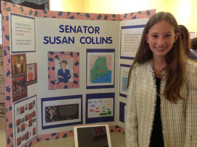 Seventh grader Ella Kuppers takes on the role of Maine Sen. Susan Collins during the U.S. Congress Wax Museum exhibit at St. Agnes Academy May 15.