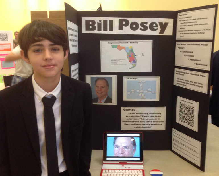Seventh grader Christian Calvo takes on the role of Fla. Rep. Bill Posey during the U.S. Congress Wax Museum exhibit at St. Agnes Academy May 15.