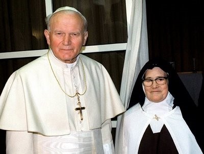 St. John Paul II visits with Lucia, one of three shepherd children of Fatima, and the only one who survived past childhood. Sister Maria Lucia of Jesus and the Immaculate Heart spent 46 years as a contemplative in the cloister of the Carmel of St. Teresa, in Coimbra.