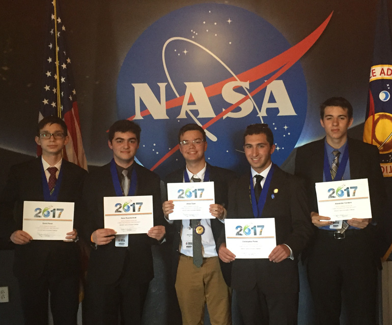 Meet Team TIER: Columbus High STEM Club students David Perez, Hans Rueckschnat, Jesus Capo, Chris Perez, and Alexander Cordero pose with their awards at the Conrad Innovation Challenge at Kennedy Space Center.