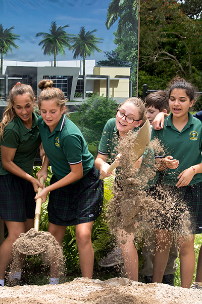 Students lend a hand at the May 24 groundbreaking for a new Mary Help of Christians Catholic School Parish & Student Center.