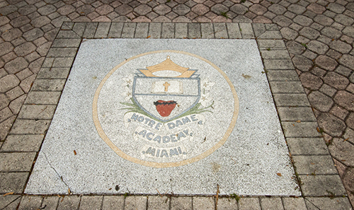 Shield of Notre Dame Academy, the all-girls school which merged with Archbishop Curley in 1981. Both schools were founded in 1953 and were the first to be integrated in Florida, in 1960.