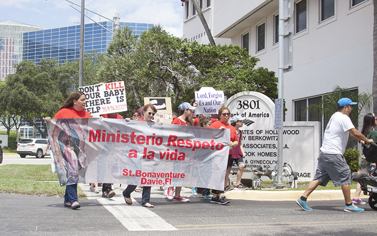 Over 200 people, from Nativity and surrounding parishes along with respect life volunteers and members of other Christian churches, took part June 11 in the Jericho Walk in Hollywood. Marchers circled “A Woman's Center," an abortion facility located on Hollywood Boulevard, seven times while praying for life.