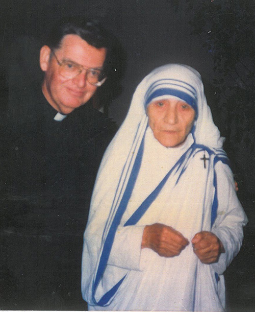 Father John McLaughlin poses with Mother Teresa during her visit to St. Martha Church in 1986.