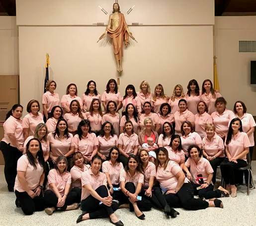 Members of Mujeres de Gracia, the Spanish-language version of Women of Grace, pose for a group photo after a recent induction ceremony.