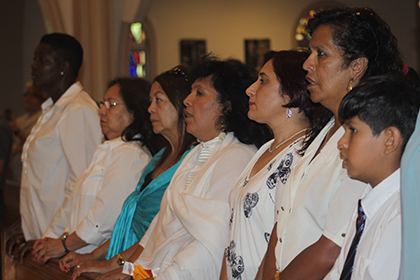 Members of Women Working Together USA take part in the Mass celebrated by Archbishop Thomas Wenski in honor of domestic workers.