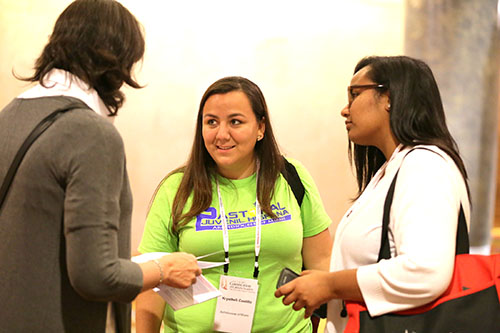 Krysthell Castillo, center, coordinator of the Pastoral Juvenil Hispana (Hispanic young adults ministry) speaks to fellow participants at the Convocation of Catholic Leaders in Orlando.