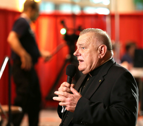 Archbishop Thomas Wenski of Miami speaks with TV media during the Convocation of Catholic Leaders in Orlando.