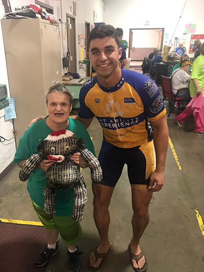 Matthew George poses with Brenda, one of the disabled adults he has met along his Journey of Hope ride from Seattle to Washington, D.C.