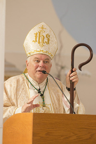 Archbishop Thomas Wenski preaches the homily on the feast of the Transfiguration at the Basilica of St. Mary Star of the Sea, before setting out on his motorcycle ride back to Miami Aug. 6. The ride will be featured in the second season of Bear Woznick's "Long Ride Home" reality series on EWTN.