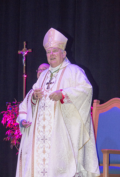 Archbishop Thomas Wenski celebrates Mass Aug. 15 for nearly 3,000 archdiocesan elementary and high school teachers gathered for their annual back-to-school assembly at the Pembroke Pines City Center.