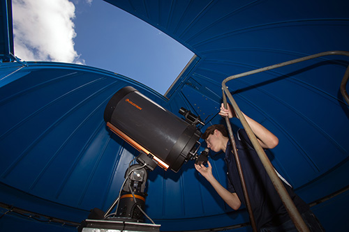 Danny Jimenez, 14, looks through the Belen Jesuit Observatory's 16" telescope.