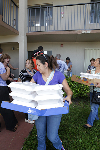 Volunteers from St. Edward Parish in Pembroke Pines prepared hot meals and set out to knock on doors and check in on senior citizen residents of the expansive Century Village Pembroke Pines housing development in western Broward County on Sept. 14. The residents there had been without electricity and air conditioning for days.
