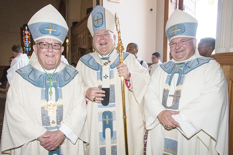 Archbishop Thomas Wenski poses with his predecessor, at left, Archbishop Emeritus John C. Favalora, who ordained him a bishop 20 years ago, and Auxiliary Bishop Peter Baldacchino, whom Archbishop Wenski ordained as bishop three years ago.