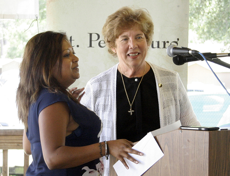 Devika Austin, chief administrative officer for Cathoilc Charities of the Miami Archdiocese, left, offers thanks for funds earmarked for emergency services following Hurricane Irma presented to her by Sister Donna Markham, executive director and CEO of Catholic Charities USA. Sister Markham visited Florida and offered collectively $ 2 million in funds to the seven Florida agencies during a presentation Sept. 19 at Pinellas Hope in Clearwater.