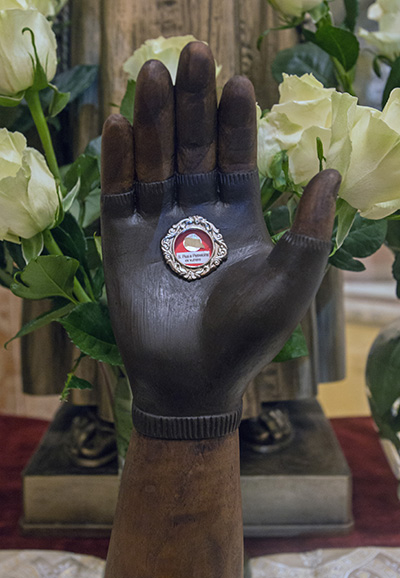 Those who attended the annual Padre Pio Mass at St. Mary Cathedral also venerated this first-class relic of the saint's garment stained with blood from his stigmata.