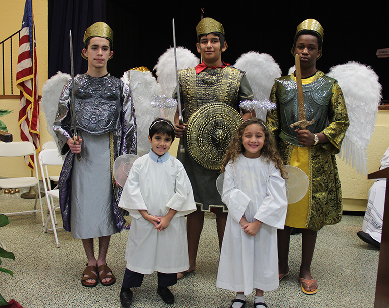 Angels and archangels, from left, Gabriel, Michael and Raphael, represented by St. Michael School eighth graders and kindergarten students.