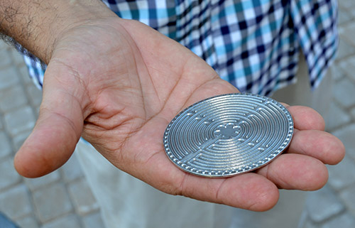 Members of the steering committee for the prayer labyrinth were given a thank-you gift of a small metal labyrinth. The object is a replica of a 42-foot labyrinth in the floor of Chartres Cathedral in France.