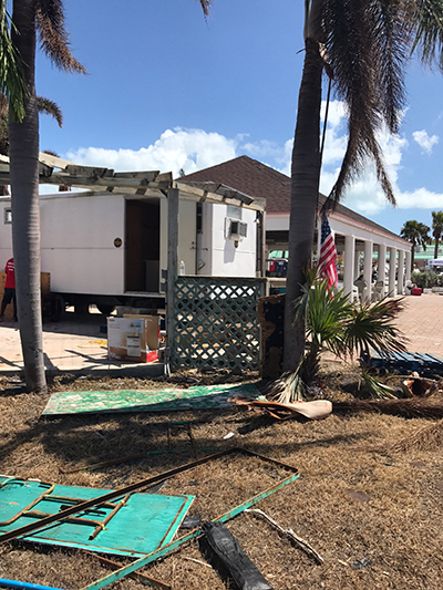 Catholic Charities delivered and installed a trailer Oct. 3 at St. Peter the Fisherman Parish in Big Pine Key to serve as a temporary sacristy and food pantry. (COURTESY PHOTO)