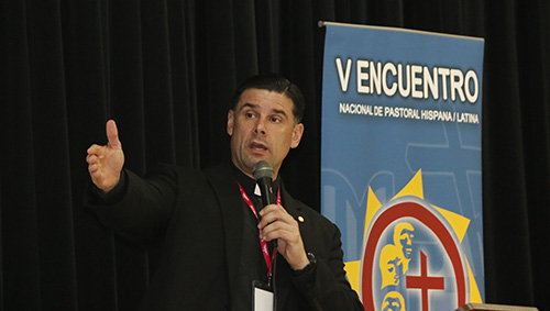 Father Rafael Capo, director of SEPI (the Southeast Pastoral Institute) and the U.S. bishops' Southeast Regional Office for Hispanic Ministry, explains the process of the V Encuentro to archdiocesan delegates gathered at Immaculate Conception's Mercy Hall in Hialeah.