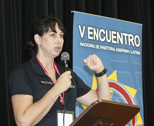Rosemarie Banich, co-chair of the V Encuentro in the archdiocese, gives instructions for a reflection to archdiocesan delegates gathered at Immaculate Conception's Mercy Hall in Hialeah.