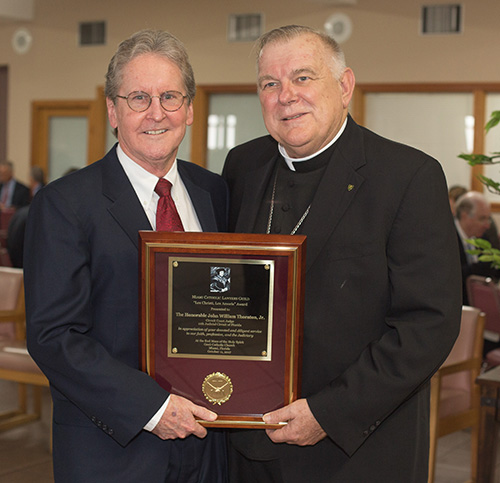 Archbishop Thomas Wenski poses for a photo with Circuit Judge John W. Thornton, Jr., recipient of the Miami Catholic Lawyers Guild 2017 Lex Christi, Lex Amoris award.