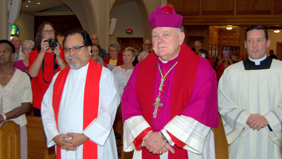 Lutheran Bishop-elect Pedro Suarez, left, and Archbishop Thomas Wenski walk side by side in procession during the Common Prayer service for Reformation 500 at St. Mary Cathedral. At far right is the Rev. Richard Vigoa, the archbishop's priest-secretary.