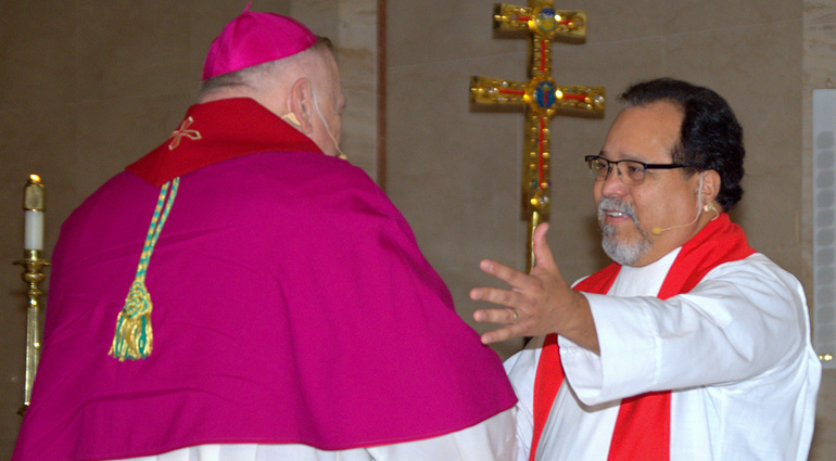 Archbishop Thomas Wenski, left, and Lutheran Bishop-elect Pedro Suarez embrace during the Common Prayer service for Reformation 500 at St. Mary Cathedral.
